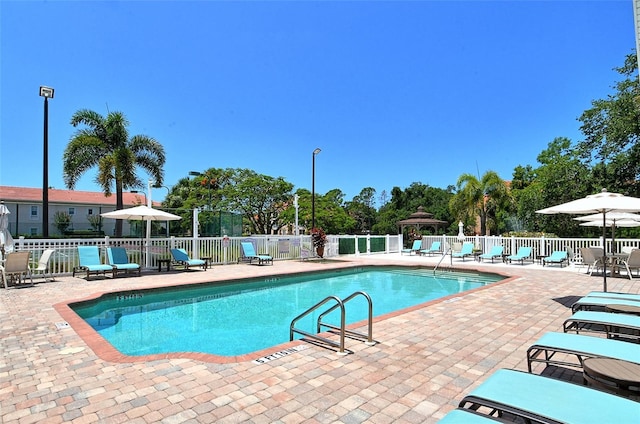 view of swimming pool featuring a patio area and a gazebo