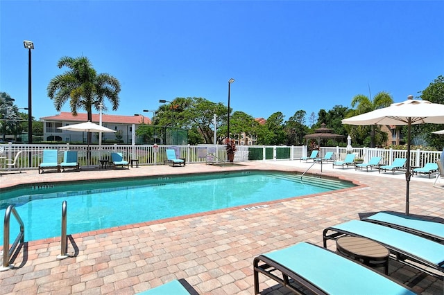 view of swimming pool featuring a gazebo and a patio