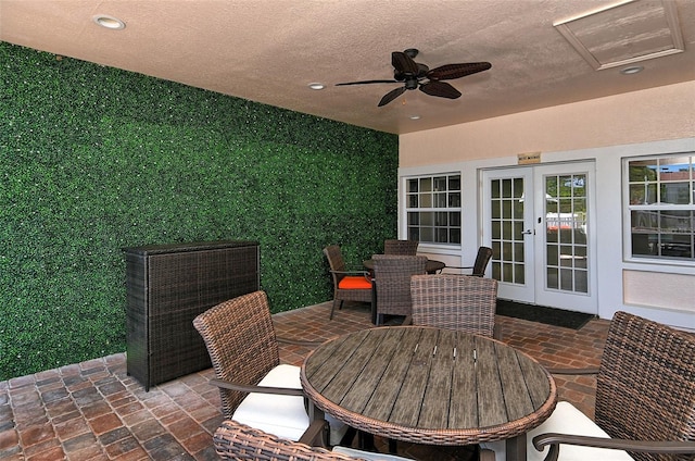 view of patio / terrace with ceiling fan and french doors