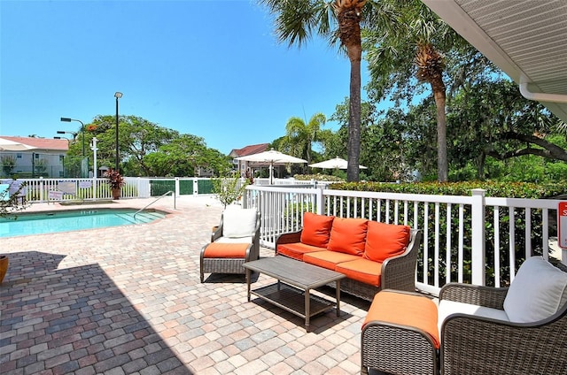 view of pool featuring a patio area and outdoor lounge area