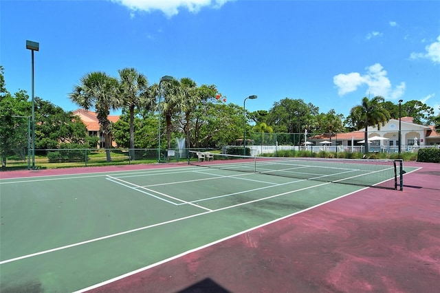 view of sport court featuring basketball hoop