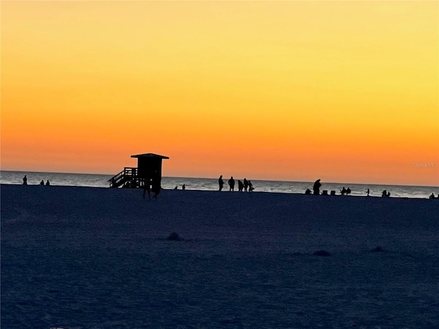 property view of water featuring a beach view