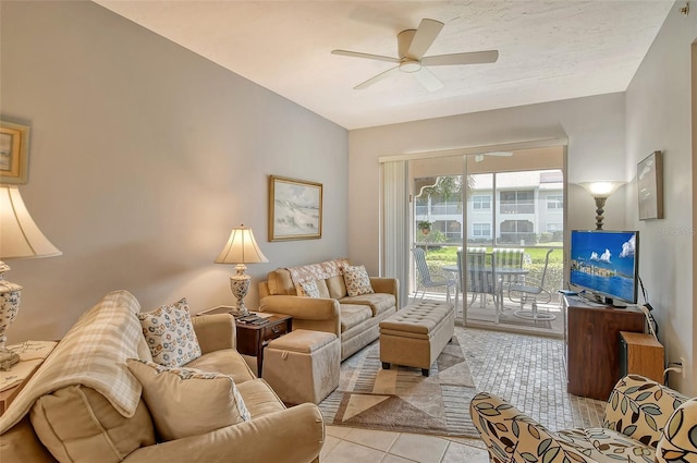 tiled living room with ceiling fan