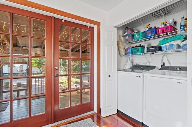 washroom with separate washer and dryer, wood-type flooring, and french doors