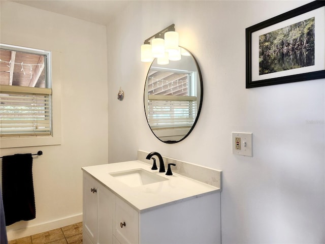 bathroom with tile patterned flooring and vanity