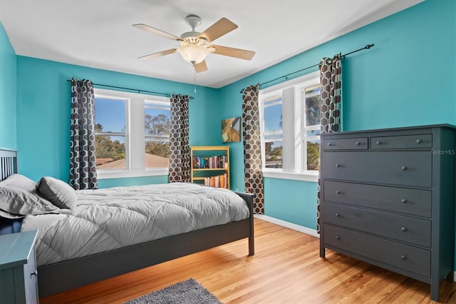 bedroom featuring ceiling fan and light hardwood / wood-style flooring