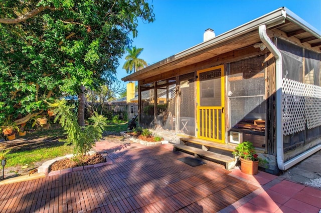 deck with a sunroom