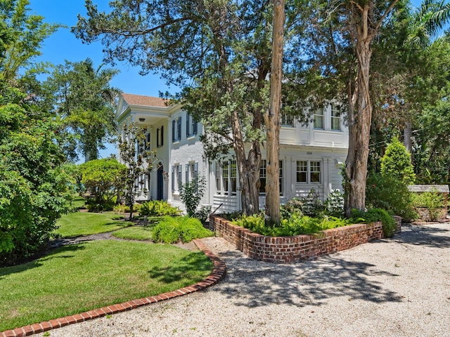 4521 Bay Shore Rd, Sarasota, FL 34234 - view of front of property with a front yard