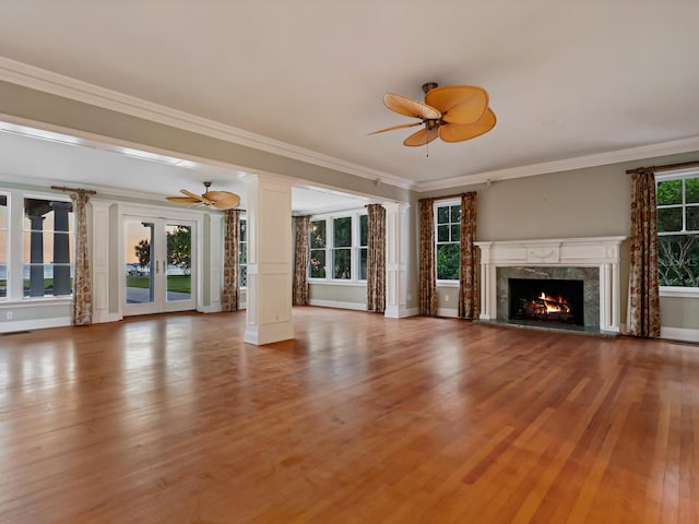 4521 Bay Shore Rd, Sarasota, FL 34234 - unfurnished living room featuring ceiling fan, wood finished floors, and crown molding