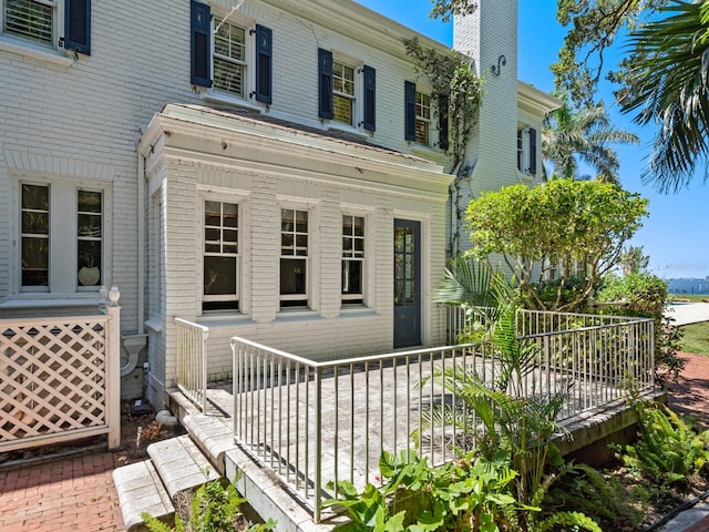 4521 Bay Shore Rd, Sarasota, FL 34234 - exterior space with brick siding and a chimney