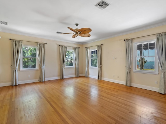 4521 Bay Shore Rd, Sarasota, FL 34234 - unfurnished room featuring a wealth of natural light, visible vents, ceiling fan, and light wood finished floors