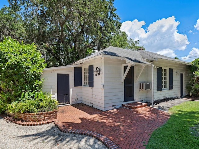 4521 Bay Shore Rd, Sarasota, FL 34234 - view of front facade with crawl space and roof with shingles