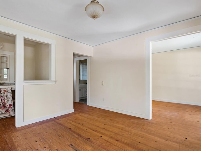 4521 Bay Shore Rd, Sarasota, FL 34234 - unfurnished room with hardwood / wood-style floors and baseboards