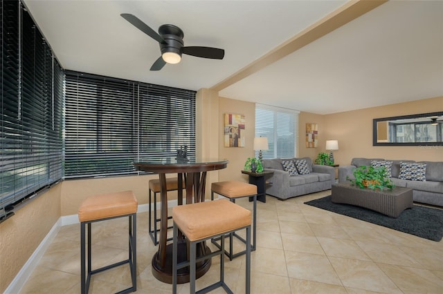 living room featuring ceiling fan and light tile patterned flooring