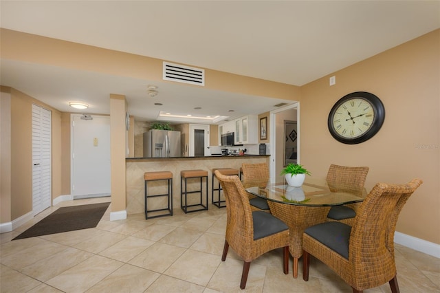 dining room featuring light tile patterned floors