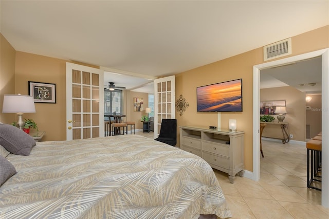 5920 Midnight Pass Rd Unit 104, Sarasota, FL 34242 - bedroom featuring light tile patterned flooring, baseboards, and french doors