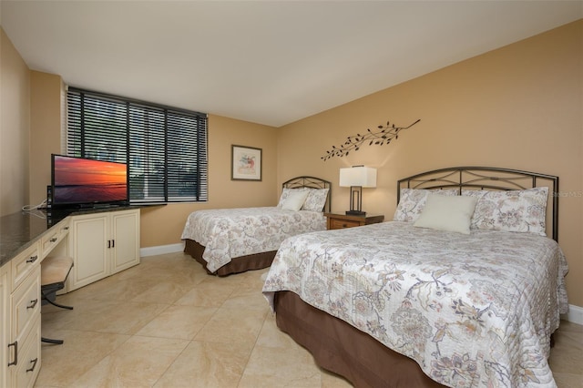 5920 Midnight Pass Rd Unit 104, Sarasota, FL 34242 - bedroom featuring baseboards and an office area