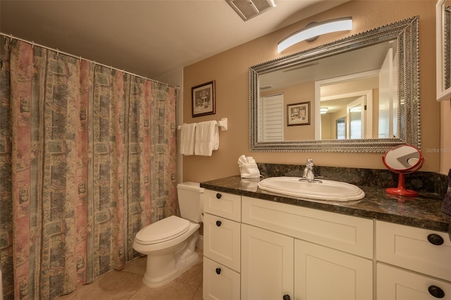 5920 Midnight Pass Rd Unit 104, Sarasota, FL 34242 - full bath with toilet, vanity, tile patterned floors, and curtained shower