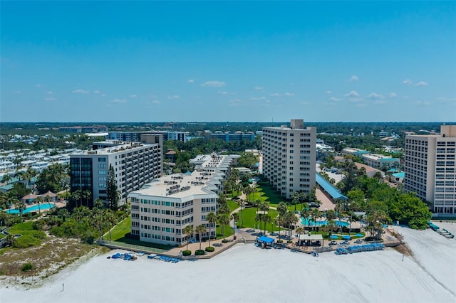 drone / aerial view with a water view and a view of the beach