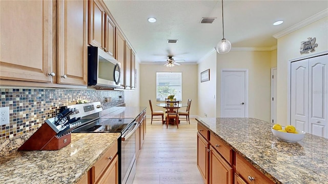 kitchen with ornamental molding, light hardwood / wood-style flooring, stainless steel appliances, backsplash, and pendant lighting