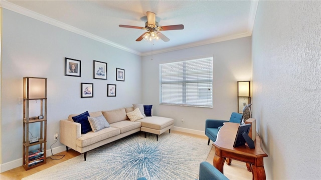 living room with hardwood / wood-style floors, ornamental molding, and ceiling fan