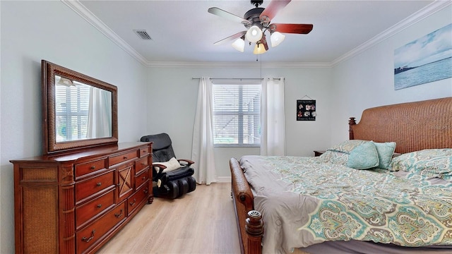 bedroom with ceiling fan, light hardwood / wood-style flooring, crown molding, and multiple windows