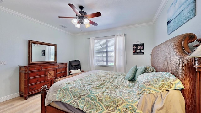 bedroom with crown molding, light wood-type flooring, and ceiling fan