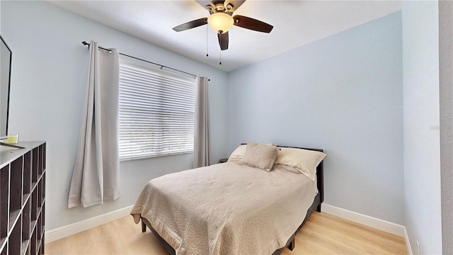 bedroom featuring ceiling fan and light hardwood / wood-style flooring