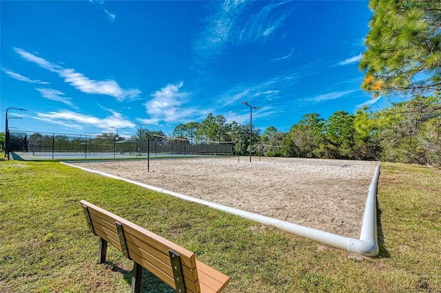 view of nearby features with a lawn and volleyball court