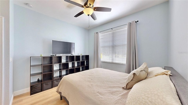 bedroom featuring ceiling fan and hardwood / wood-style floors