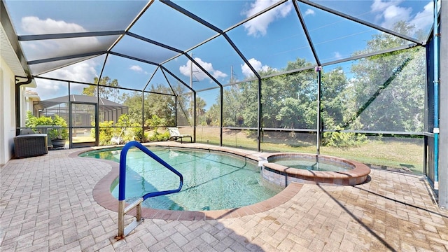 view of swimming pool with a patio area, glass enclosure, and an in ground hot tub