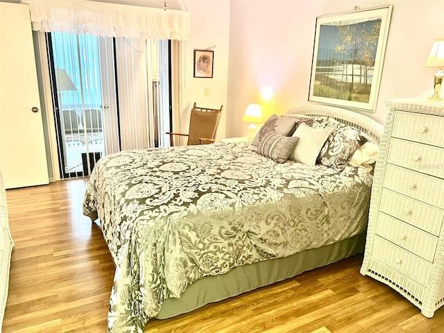 bedroom featuring access to outside and light wood-type flooring