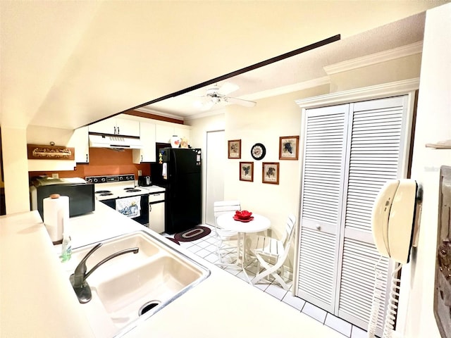 kitchen featuring white cabinets, black refrigerator, white electric stove, sink, and ornamental molding