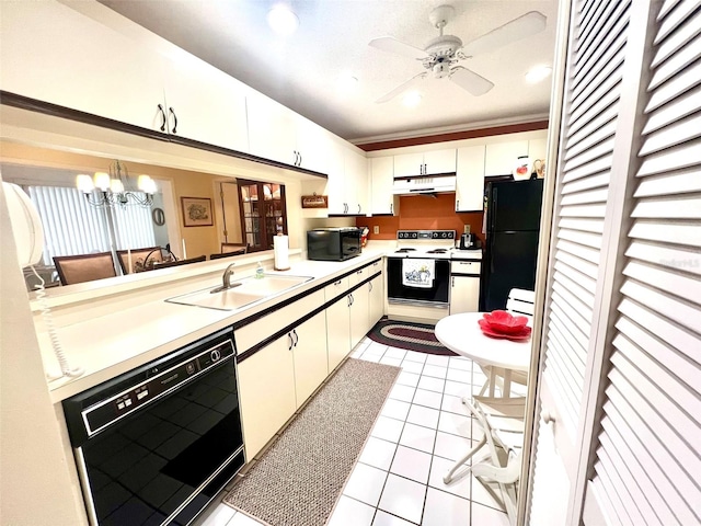 kitchen with light tile patterned floors, kitchen peninsula, black appliances, white cabinets, and sink