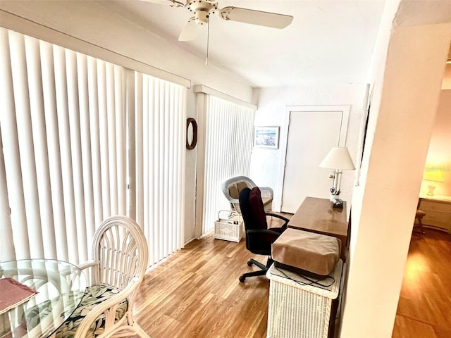 office with ceiling fan and light wood-type flooring