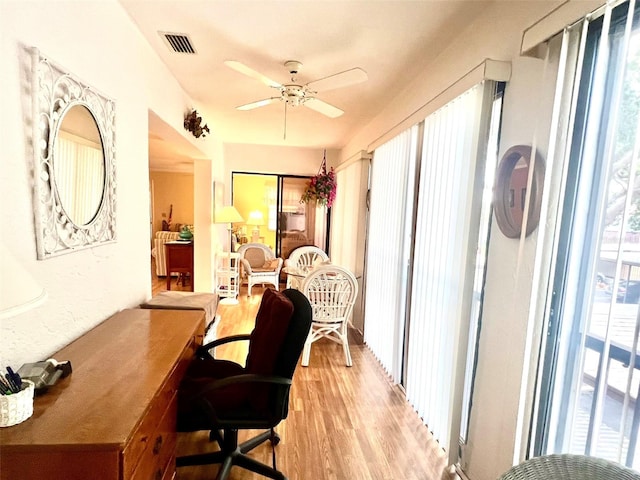 office area featuring ceiling fan and light hardwood / wood-style floors