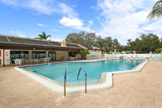 view of pool featuring a patio