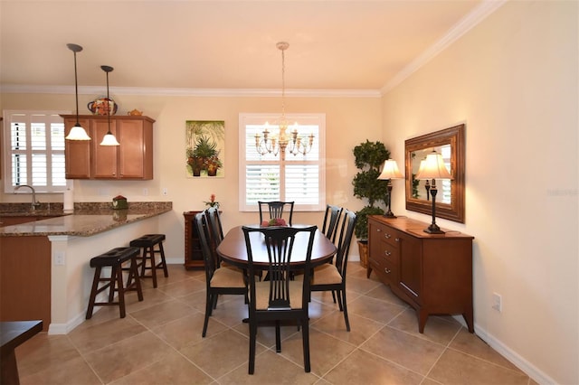 dining area featuring light tile patterned floors, baseboards, ornamental molding, and a chandelier