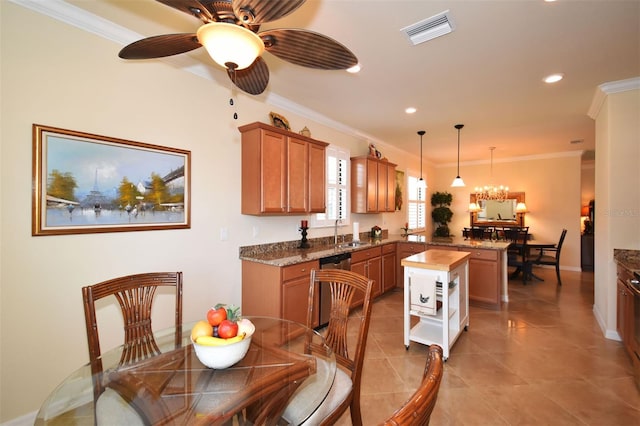 kitchen with visible vents, brown cabinets, a peninsula, a sink, and stainless steel dishwasher