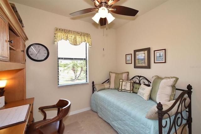 bedroom with ceiling fan and baseboards