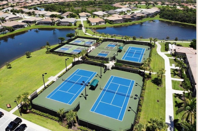 aerial view featuring a residential view and a water view