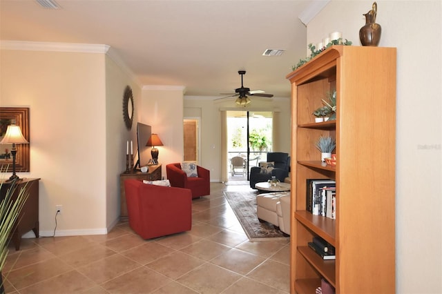 living room featuring light tile patterned floors, baseboards, visible vents, a ceiling fan, and ornamental molding