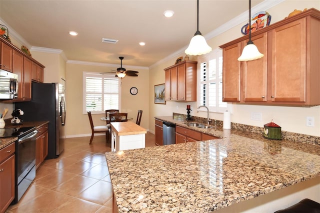 kitchen featuring ornamental molding, a peninsula, light stone countertops, stainless steel appliances, and a sink