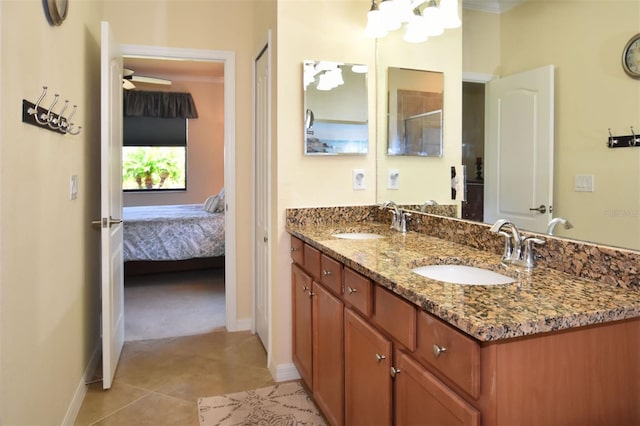 full bathroom with connected bathroom, tile patterned flooring, a sink, and double vanity