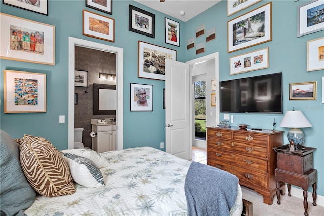 carpeted bedroom with ensuite bath