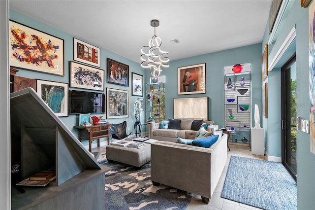 living room featuring an inviting chandelier and tile floors