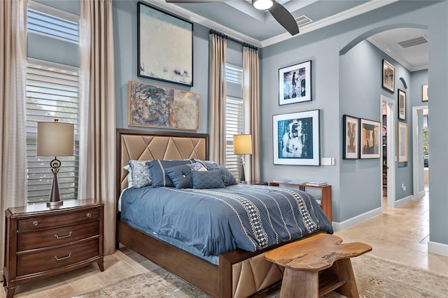 tiled bedroom with ceiling fan and ornamental molding