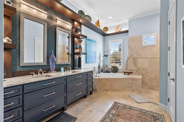 bathroom with tile flooring, ornamental molding, tiled tub, vanity with extensive cabinet space, and dual sinks