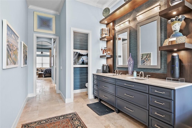 bathroom featuring tile flooring, ornamental molding, and toilet