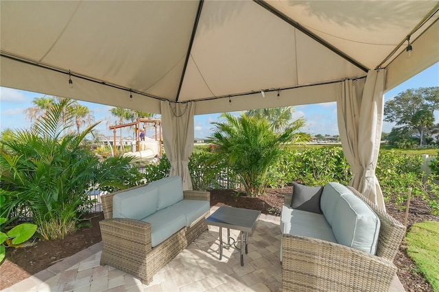 view of patio featuring outdoor lounge area and a gazebo